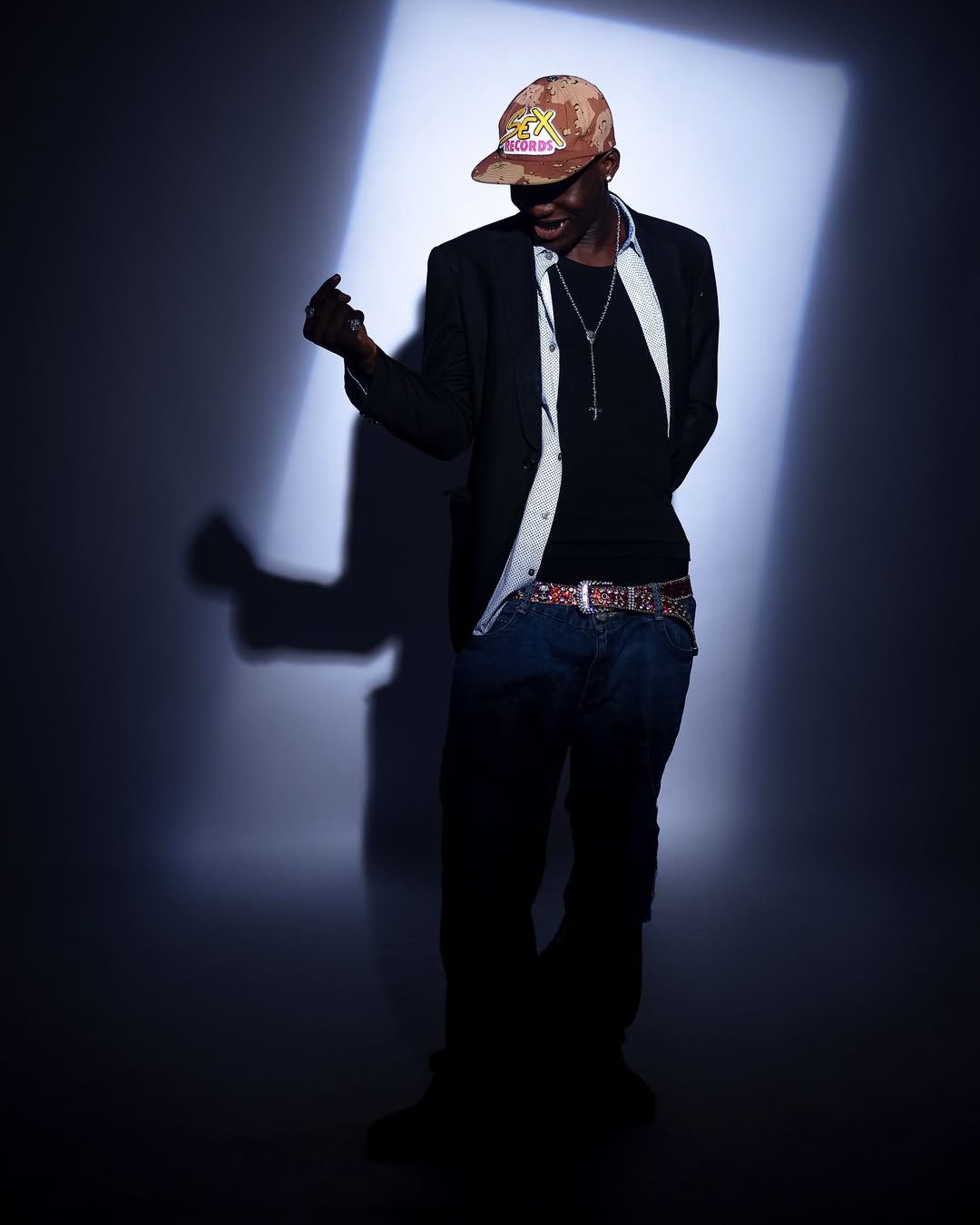 Full-body portrait of Tabby Blakes dancing in a spotlight