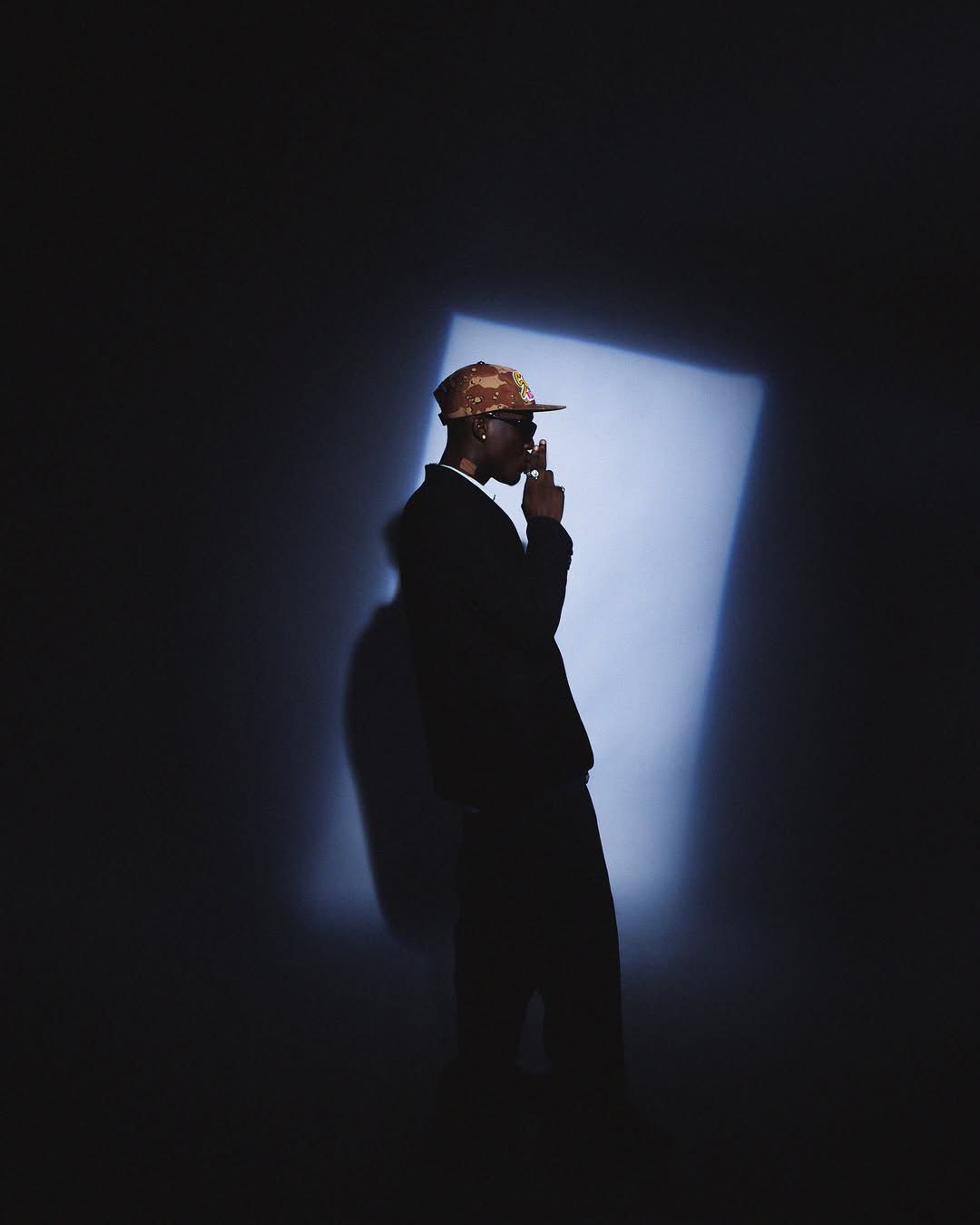 Silhouette portrait of Tabby Blakes in a spotlight
